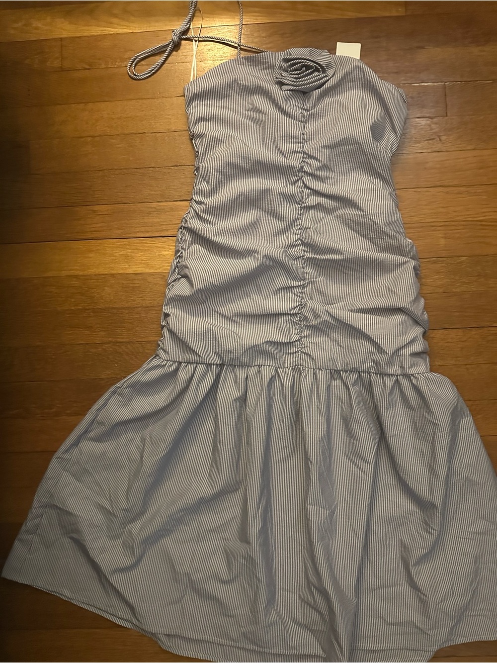 NWT 14th Place blue striped dress features a unique rosette trim at